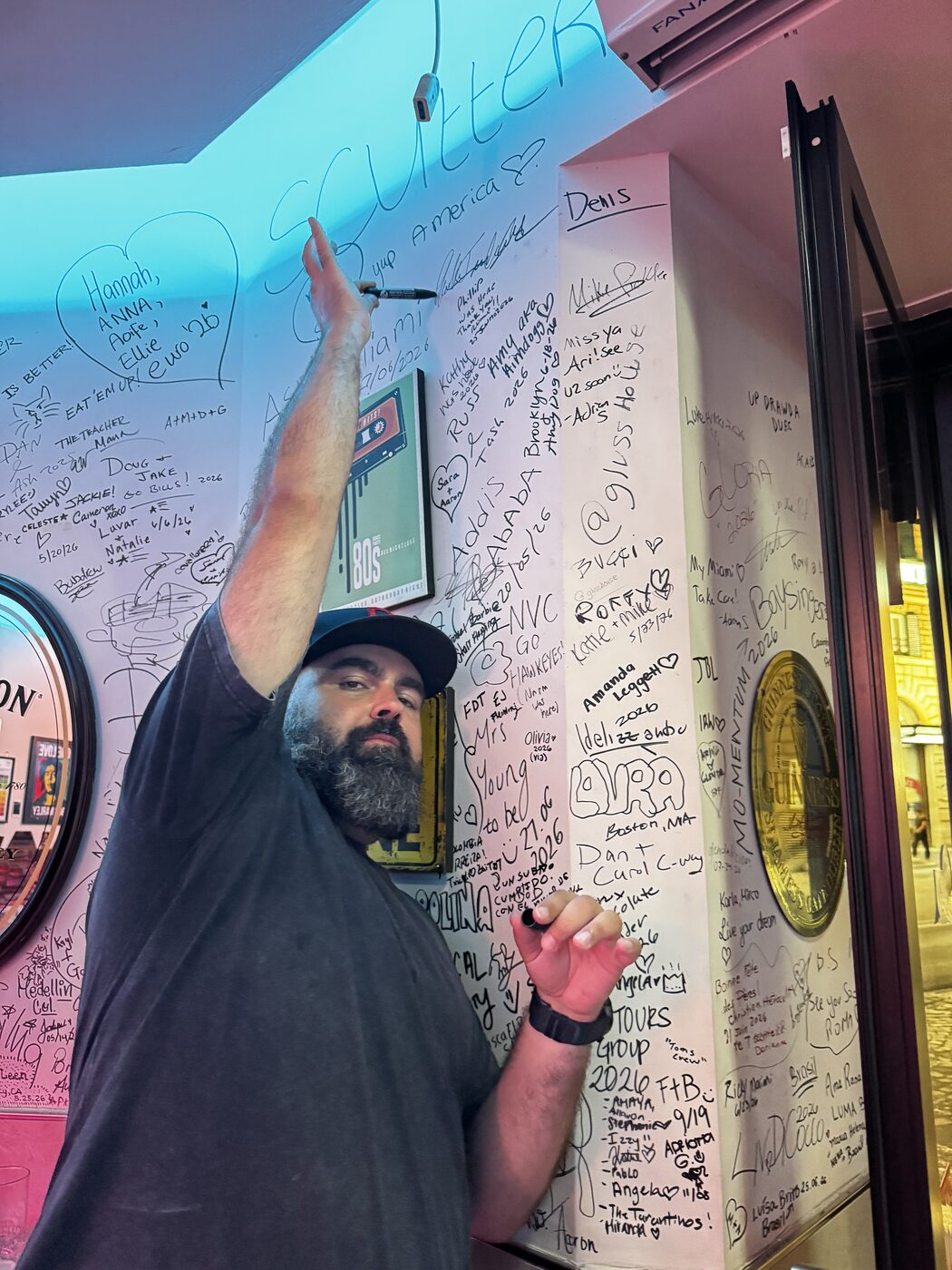 Close-up of names, dates and hometowns inked on the traveller wall